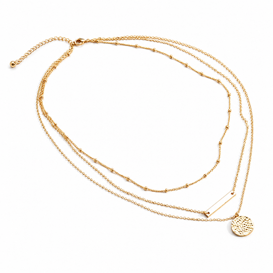 Gold necklace with multiple strands on a white background