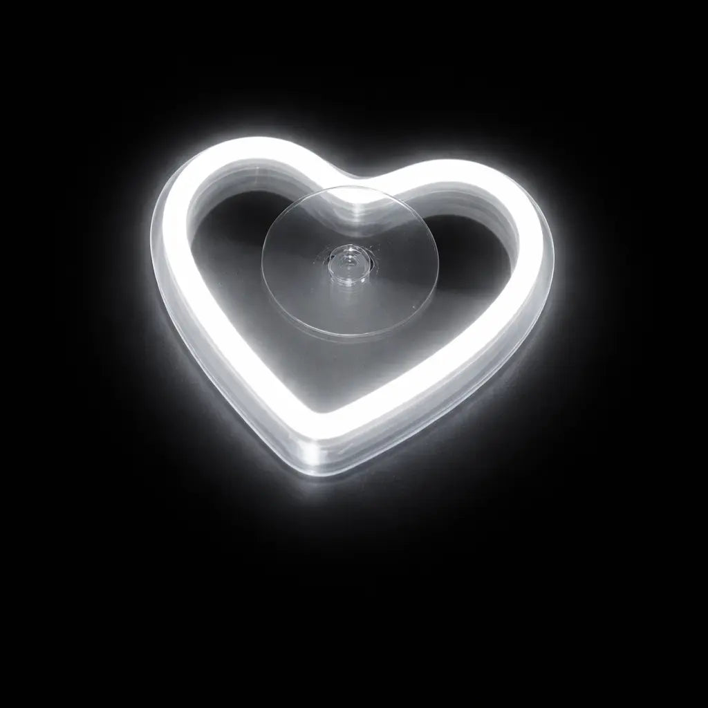 Heart-shaped suction cup on a black background
