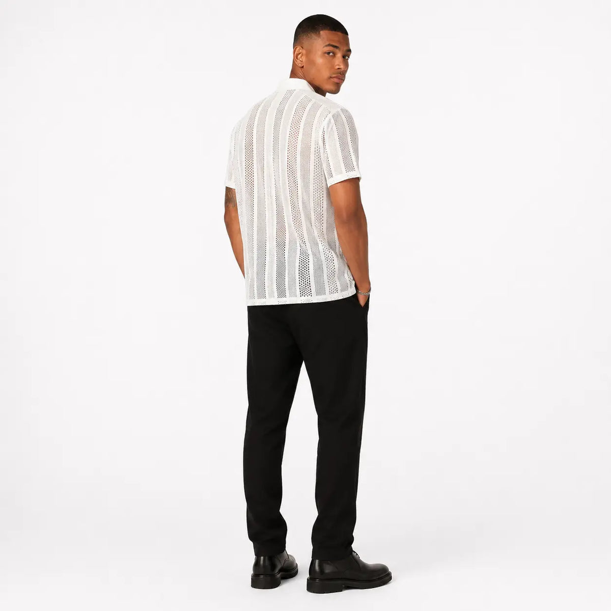 Button knitted short-sleeved shirt - stylish men's cardigan in white with vertical patterns, back view on model.