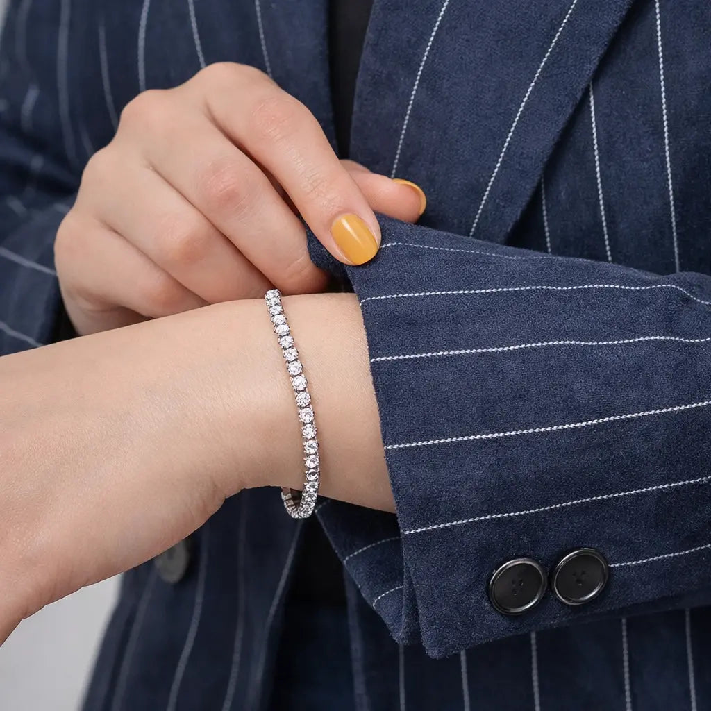 Geometric bracelet for men and women shown on a woman's wrist, silver electroplated beads, close-up view