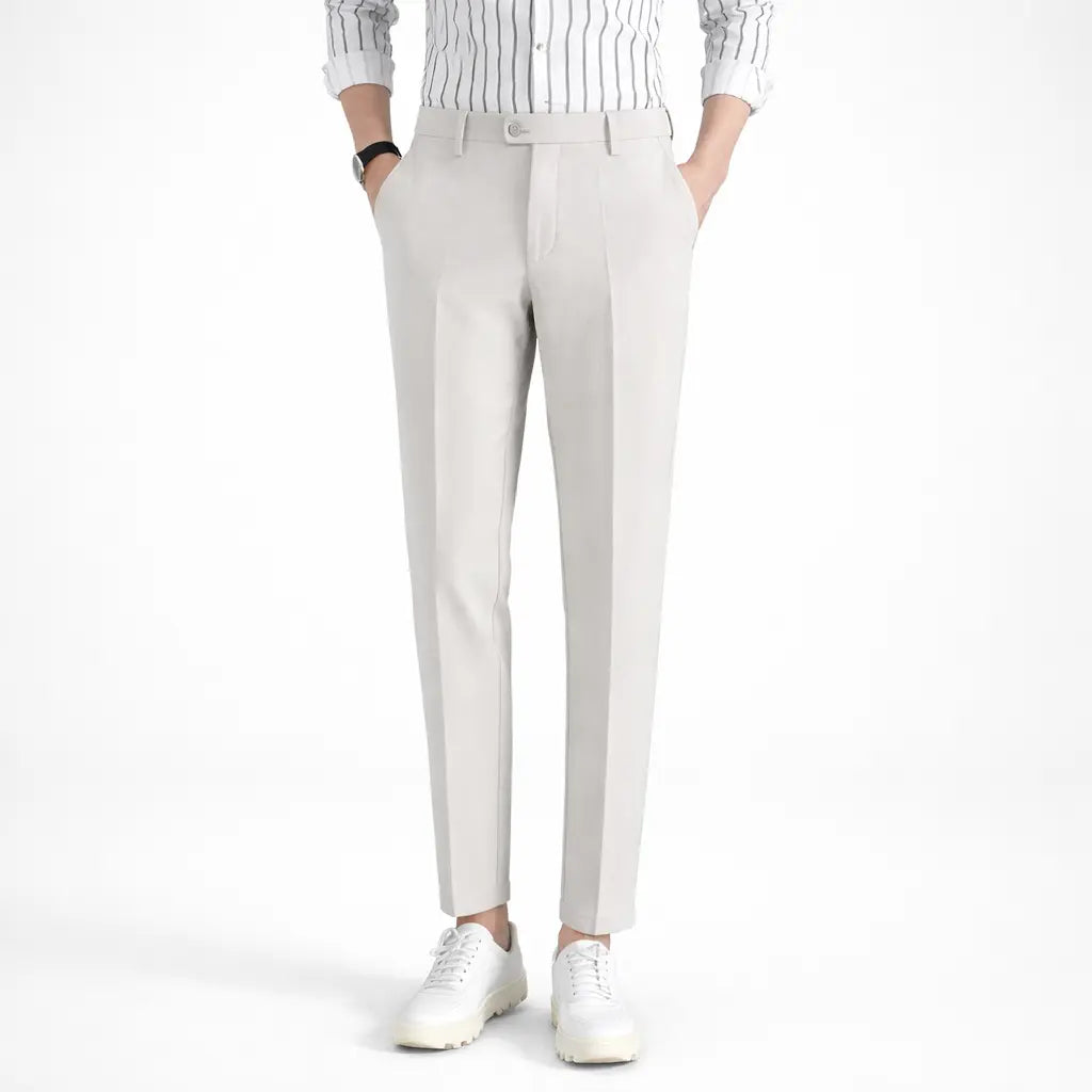 Men's casual sports pants, slim fit light beige cotton blend front view on male model with white sneakers