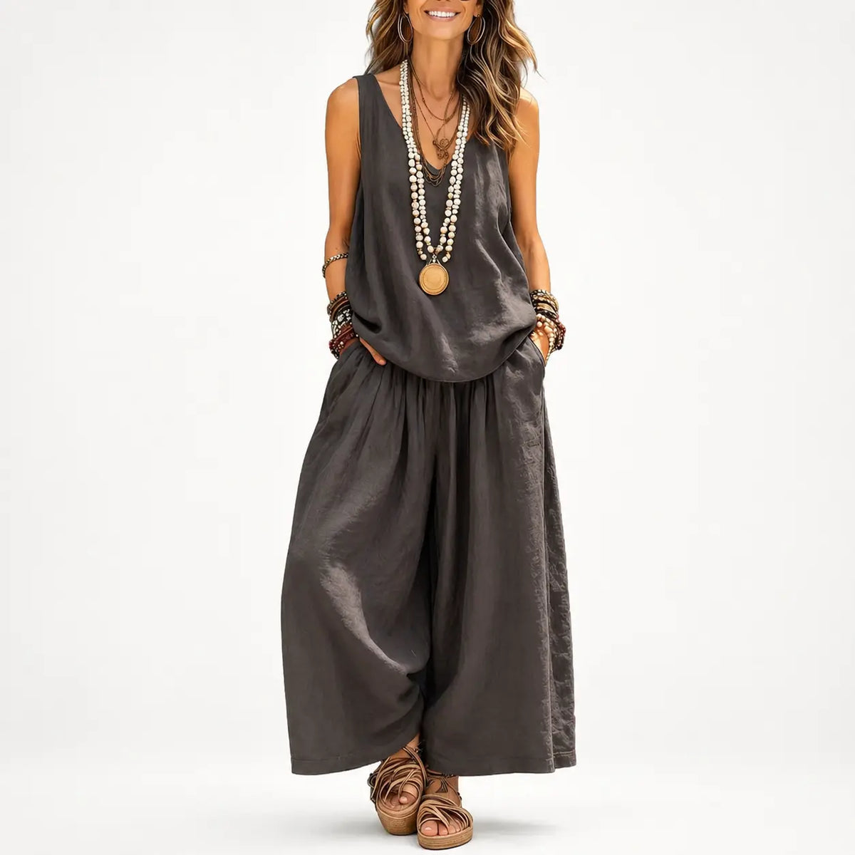 Cotton-linen two-piece set in dark gray, model wears sleeveless top and wide-leg pants, hands in pockets.