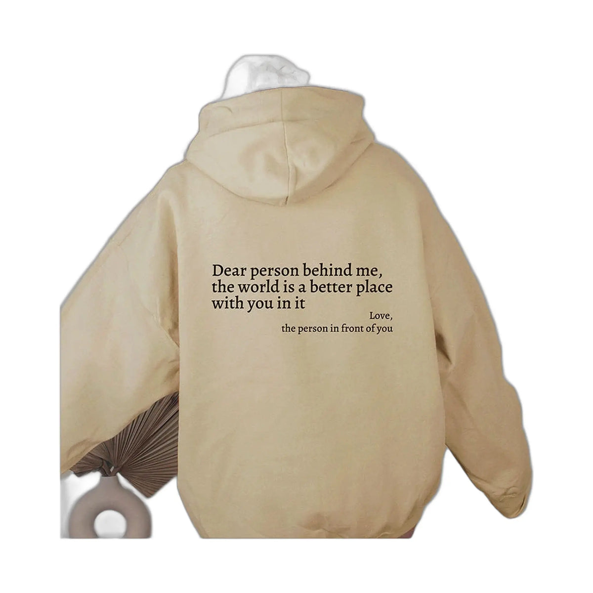 beige hoodie with uplifting message on back dear person behind me