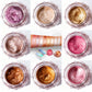 Collage of various colorful eye shadows in small jars on a white background