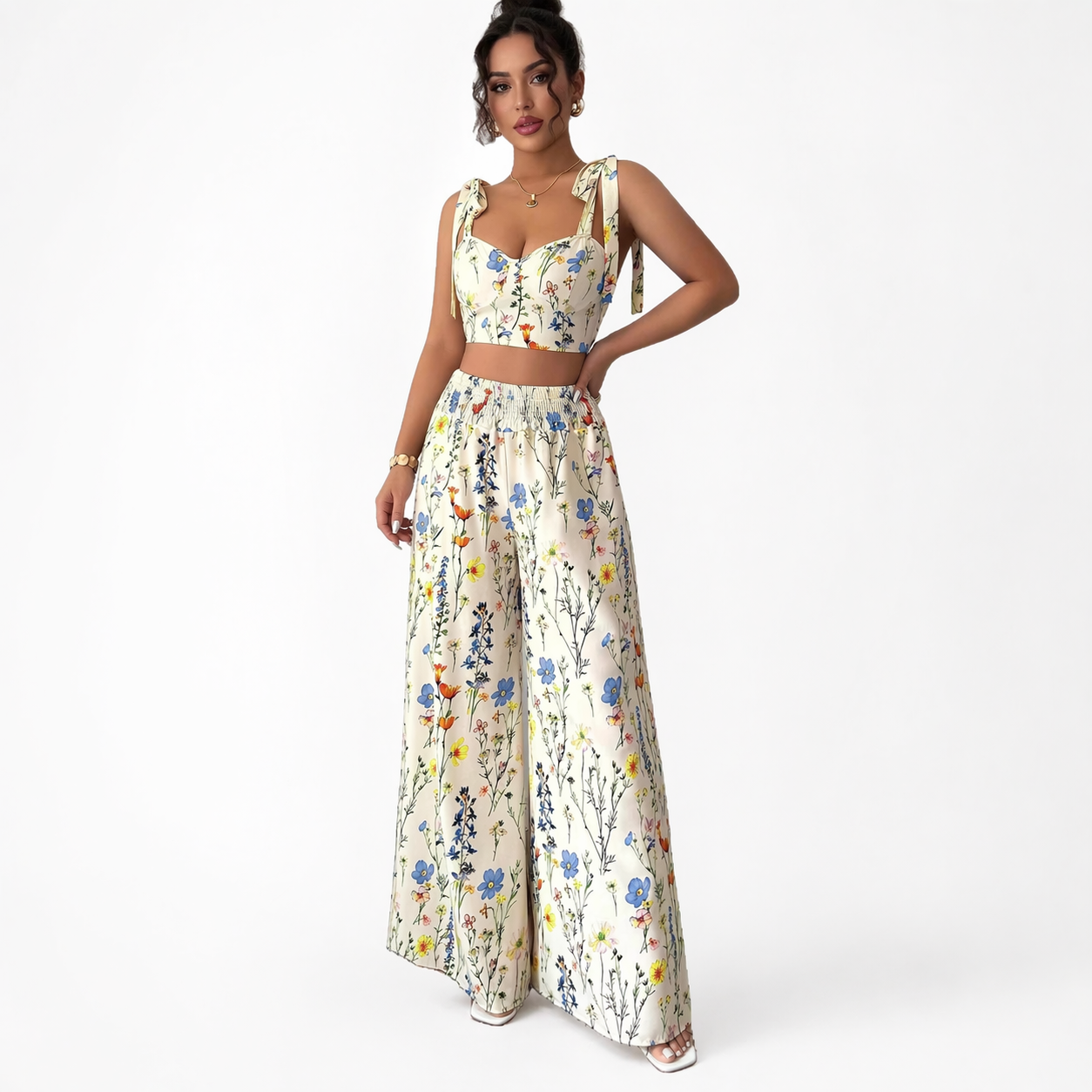 Woman wearing a floral two-piece outfit on a white background