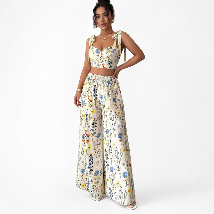 Woman wearing a floral two-piece outfit on a white background