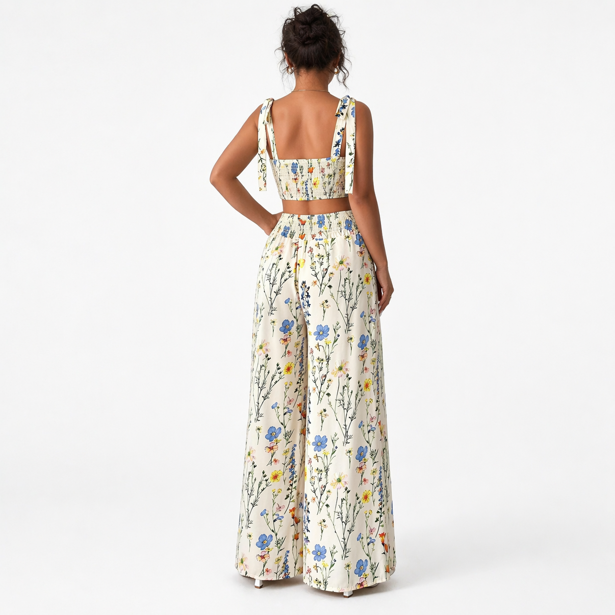 Woman wearing a floral dress on a white background