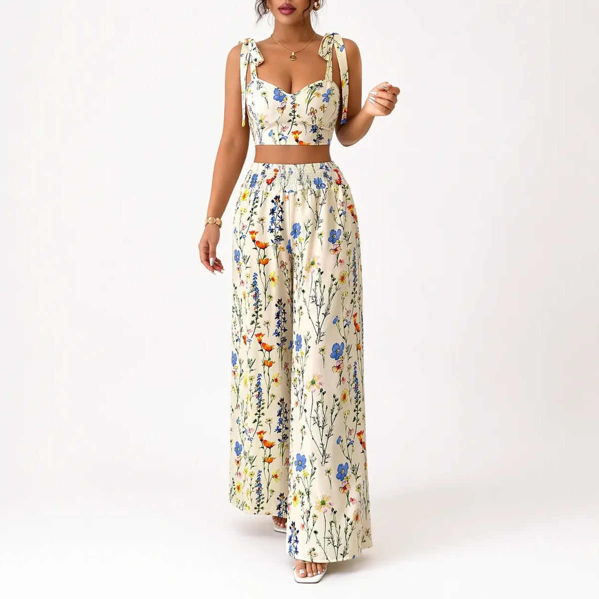 Printed camisole set for women displaying a white floral top with tie straps and wide-leg pants, side view.