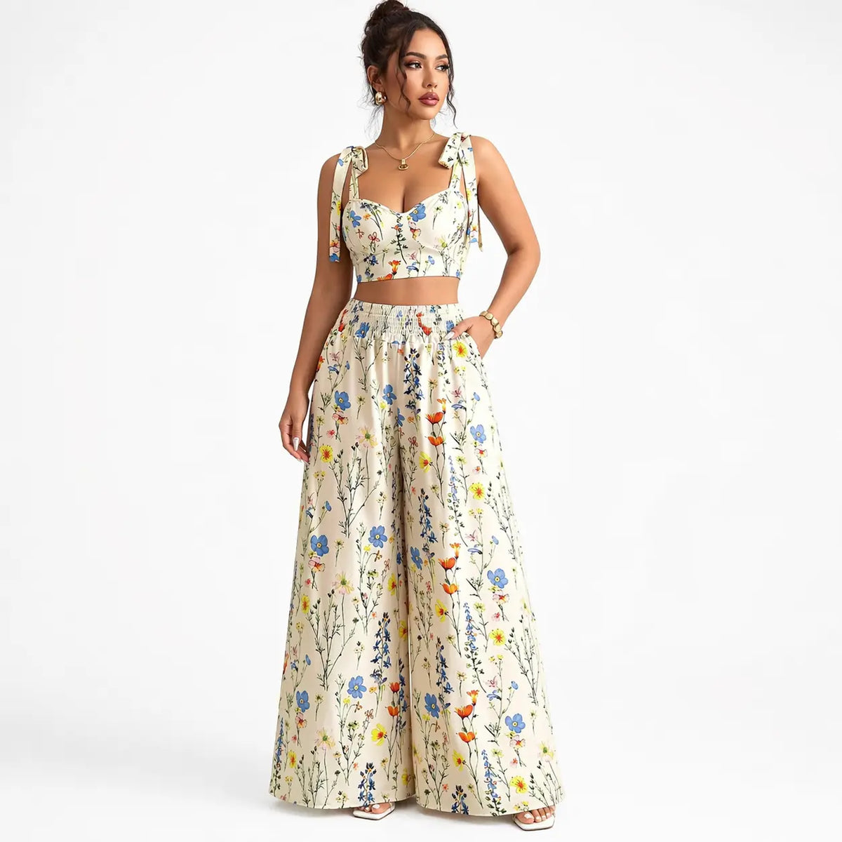 Printed camisole set for women with a white floral top and wide-leg pants, front view with hand in pocket.