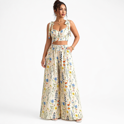 Woman wearing a floral two-piece outfit on a white background