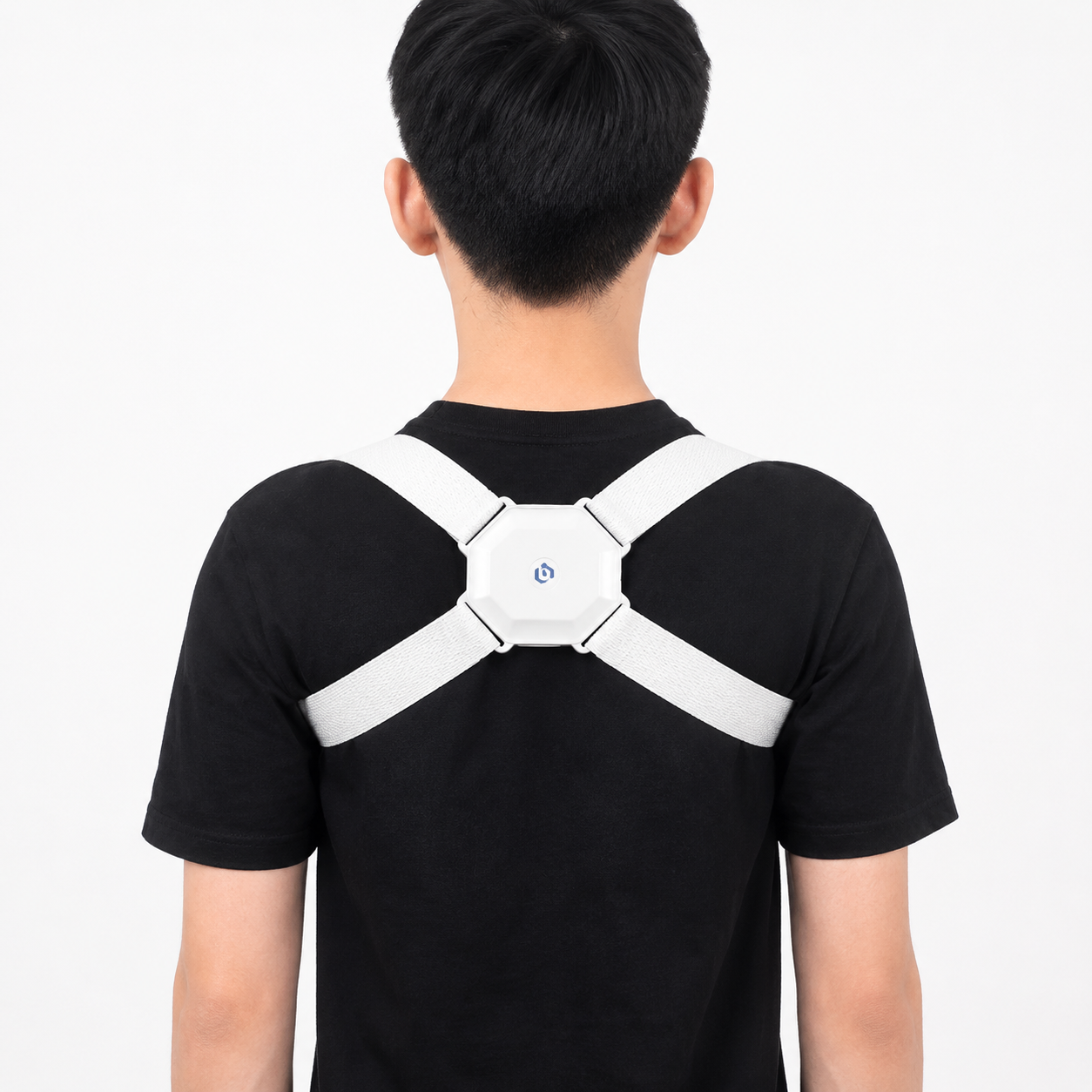 Person wearing a white posture corrector on a plain background