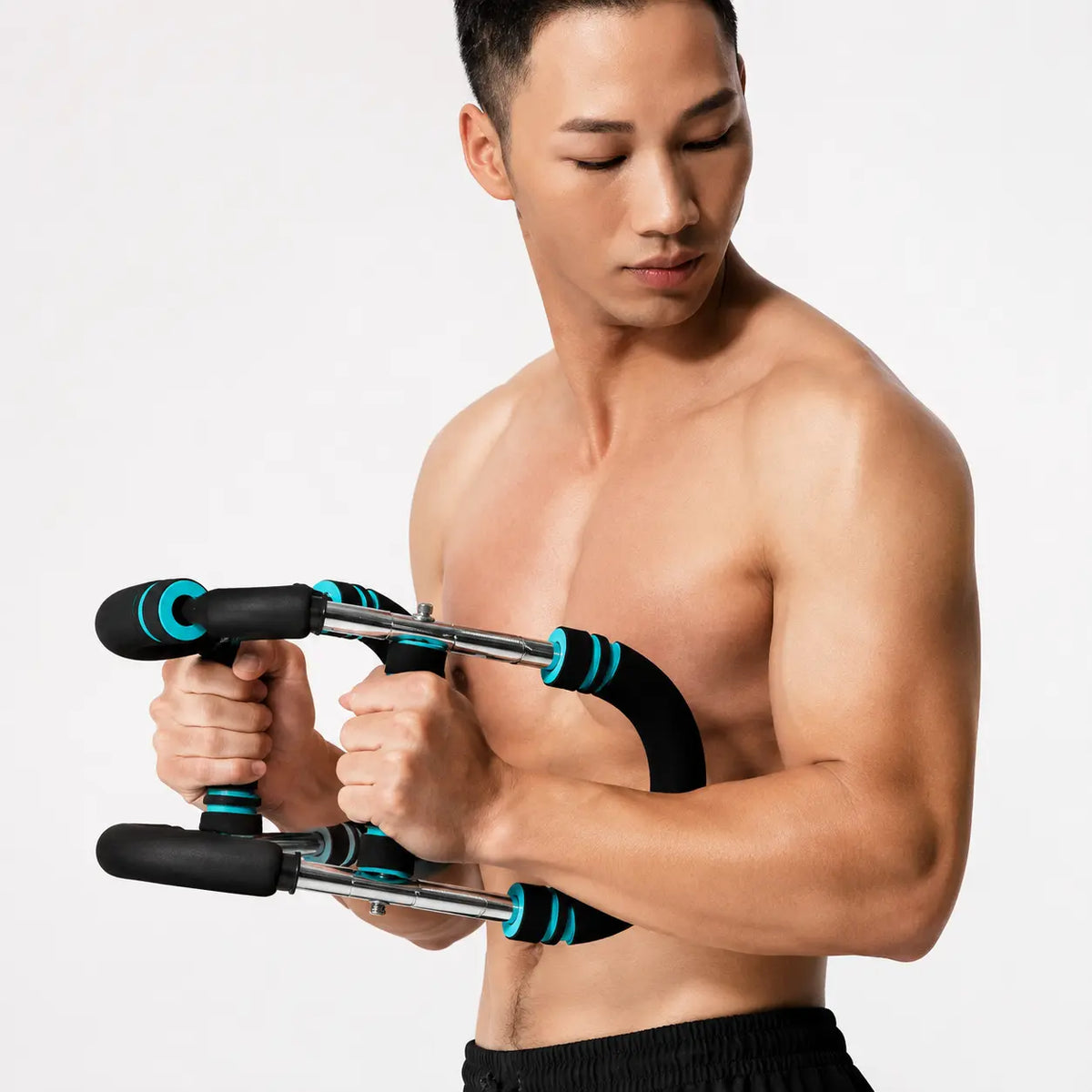 Multi-functional u-shaped arm strengthener black and teal variant used by shirtless man performing exercise