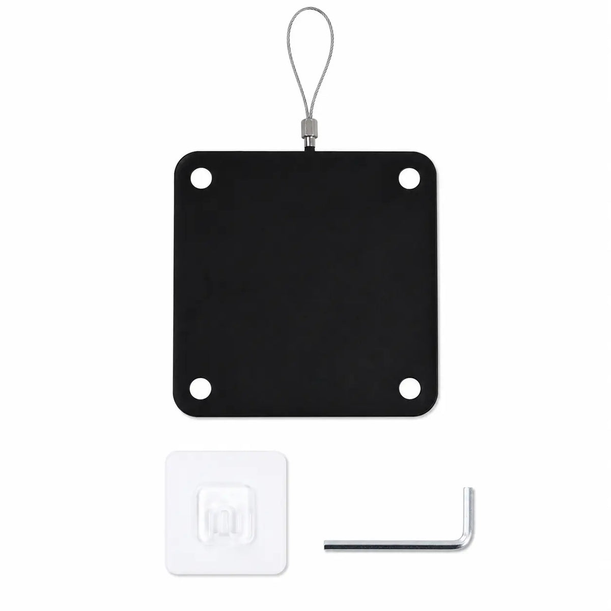 Black square metal plate with holes, white square label, and small tool on a white background