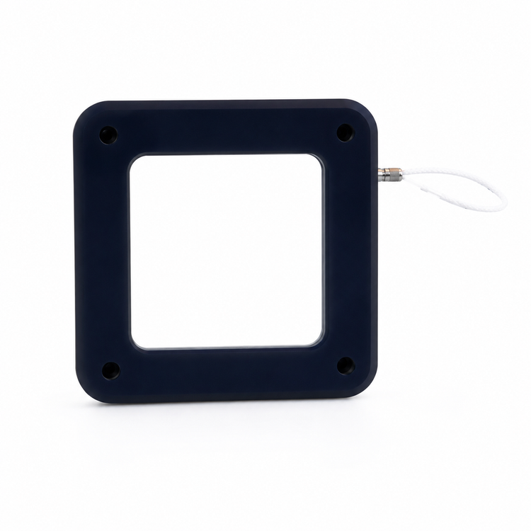 Black square electronic component with USB cable on a white background