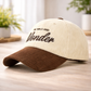 Beige and brown cap with &