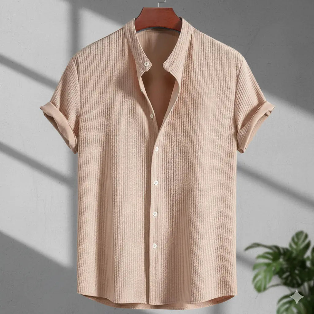 Men's short sleeve loose shirt - beige breathable polyester summer top on hanger near window and plant