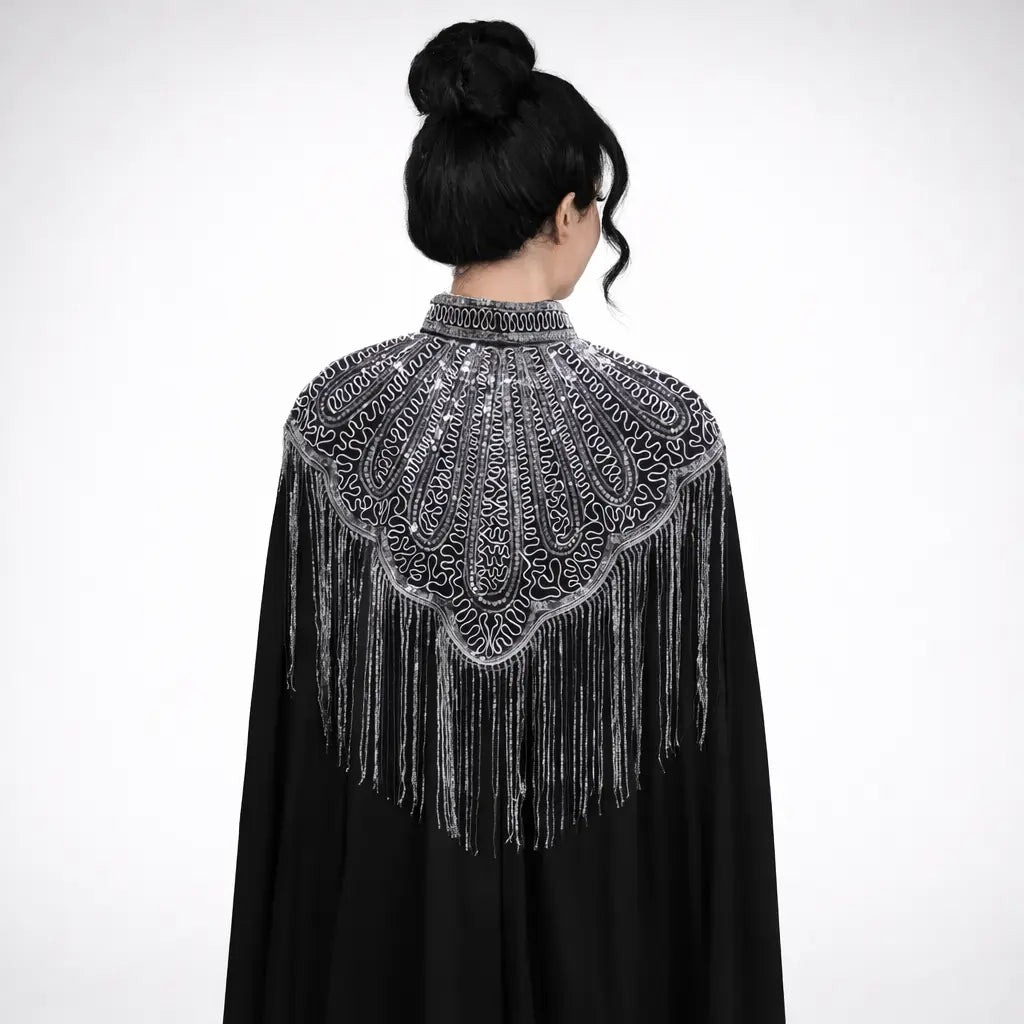 women's ethereal chiffon gown with tassels in black with intricate silver back detailing and fringes