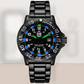 Black wristwatch with blue and green accents on a light gray background