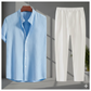 Blue striped shirt and white pants on a gray background