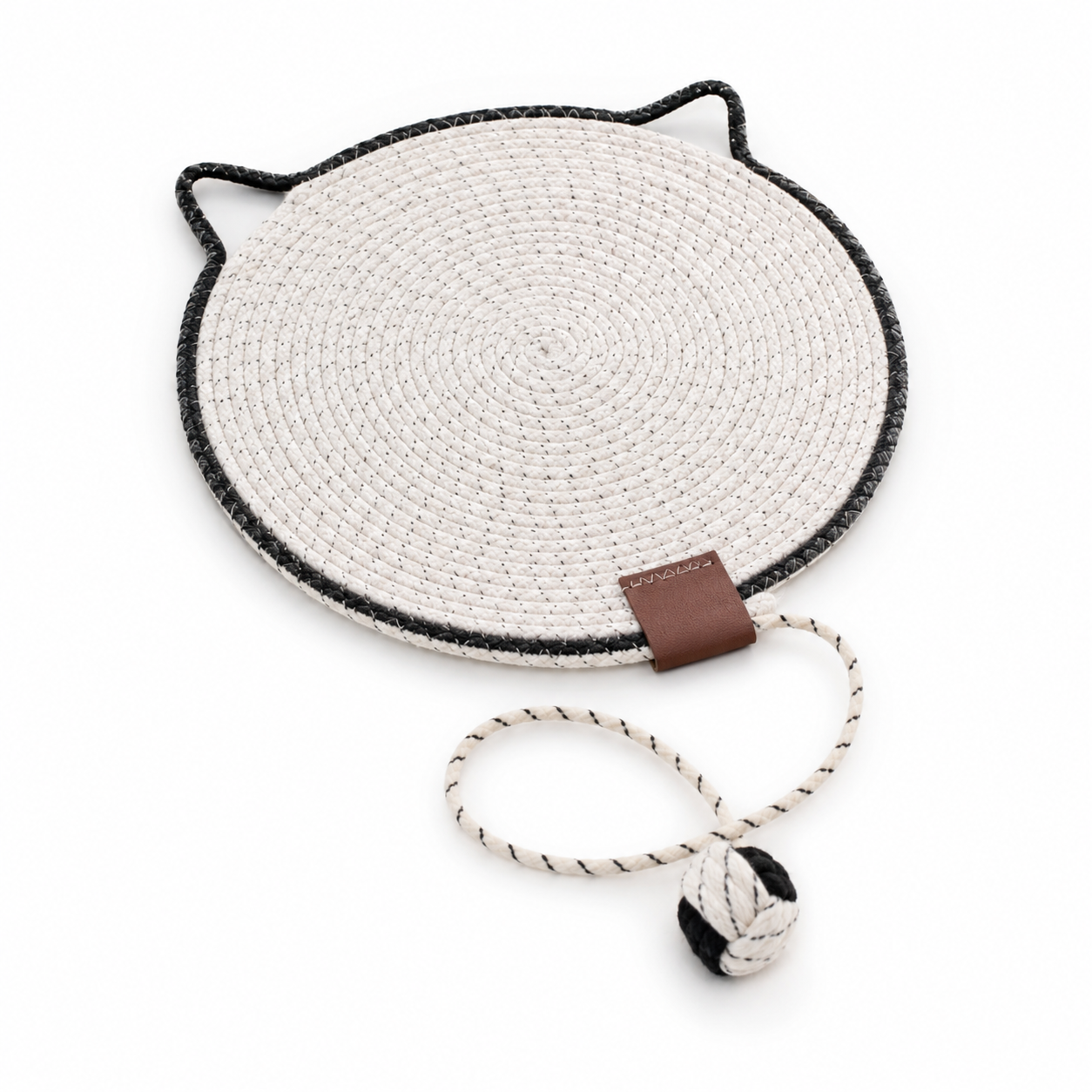 Round woven mat with cat ears and a small ball toy on a white background