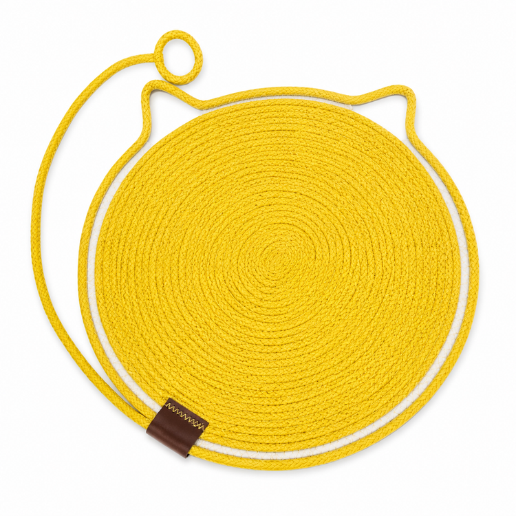 Yellow circular mat with a brown strap and logo on a white background
