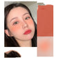 Close-up of a person with orange makeup swatches on a white background