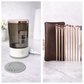 Collage of a humidifier, a brown pouch with makeup brushes, and a gray mat on a white surface.