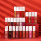 Collection of lip glosses arranged in a pyramid on a red background