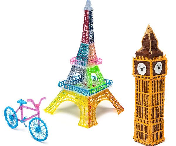 Colorful 3D puzzle models of the Eiffel Tower and Big Ben on a white background