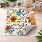 Colorful cartoon-themed rug on a wooden floor with various illustrations and text.