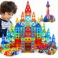 Child playing with colorful magnetic building blocks on a white background