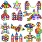 Colorful magnetic building blocks arranged in various shapes on a white background
