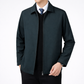Dark green jacket worn by a person on a white background