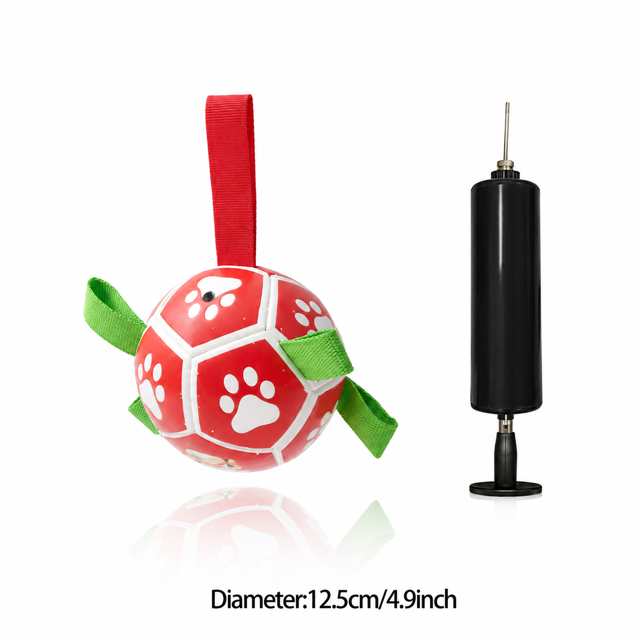 Red and white turtle-shaped dog toy with a green strap and black pump on a white background