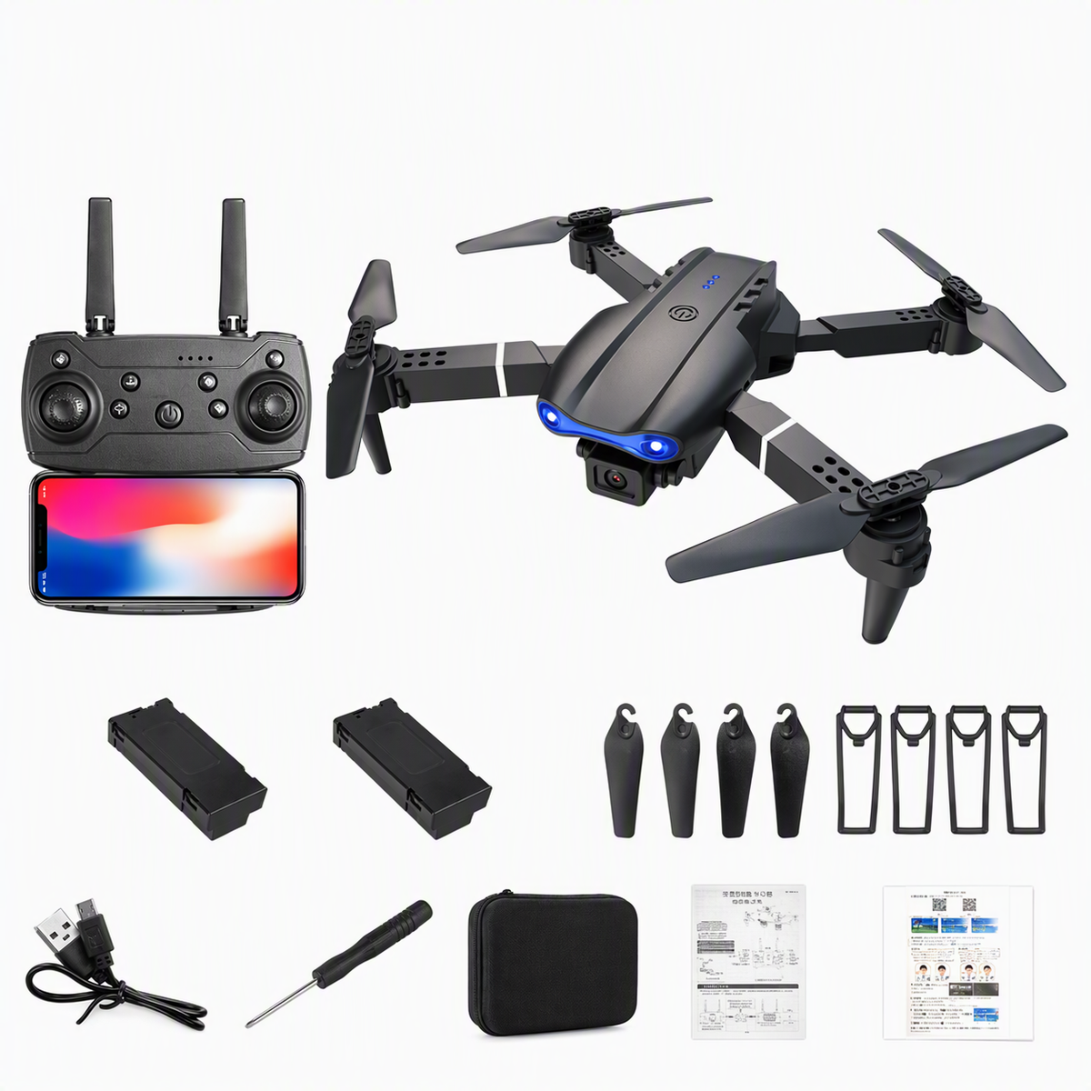 Black quadcopter drone kit with remote controller, smartphone screen, two batteries, four propeller blades, screwdriver, USB cable, carrying case, and instruction manual on a white background.