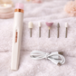 Electric nail drill with attachments and cable on a soft surface WHITE