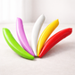 Five colorful balloons in green, purple, white, yellow, and red on a white background