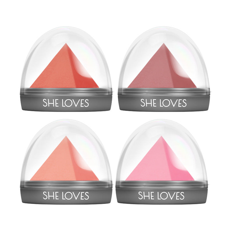 Four lip balm containers with pink triangles and &