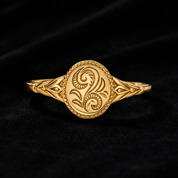 Gold ring with intricate design on a black background