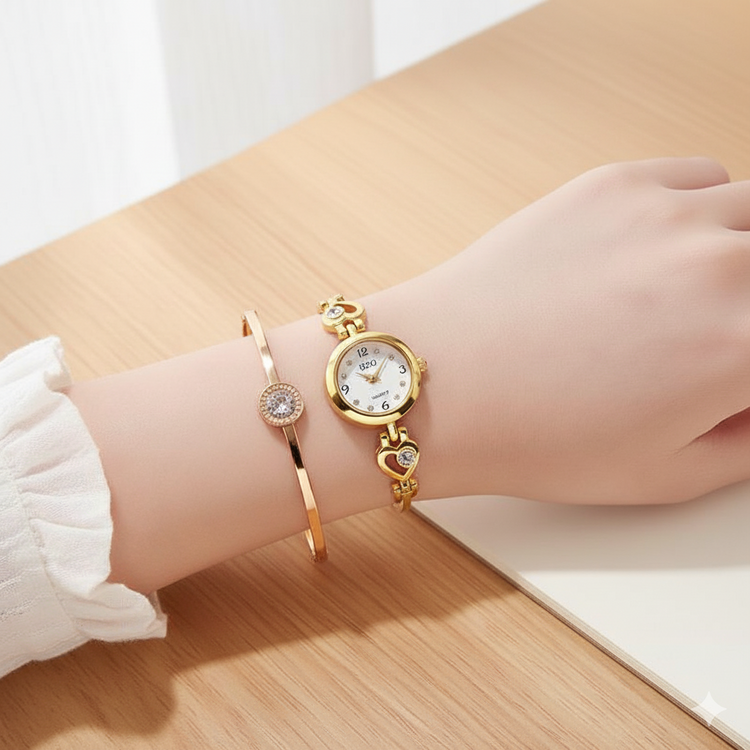 Gold wristwatch and bracelet on a wrist with a white background