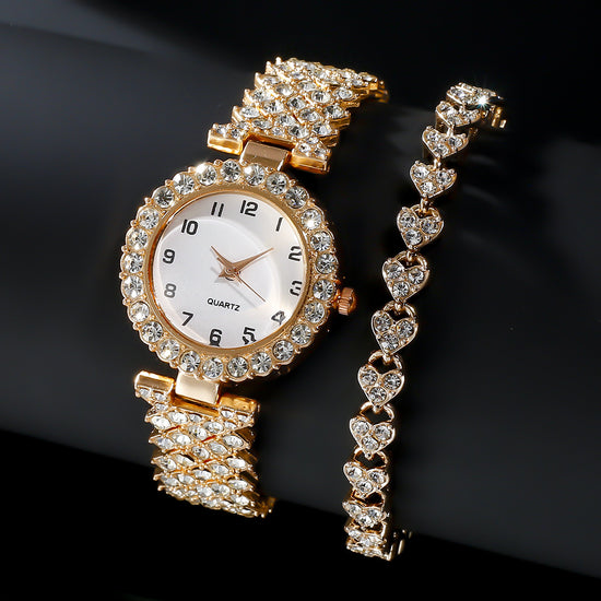 Gold wristwatch with diamond-studded band on a black background