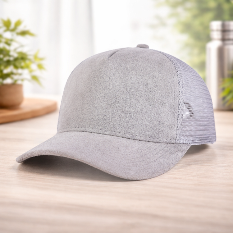 Gray baseball cap on a wooden surface with a blurred background