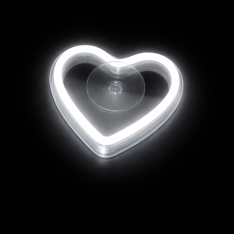 Heart-shaped suction cup on a black background