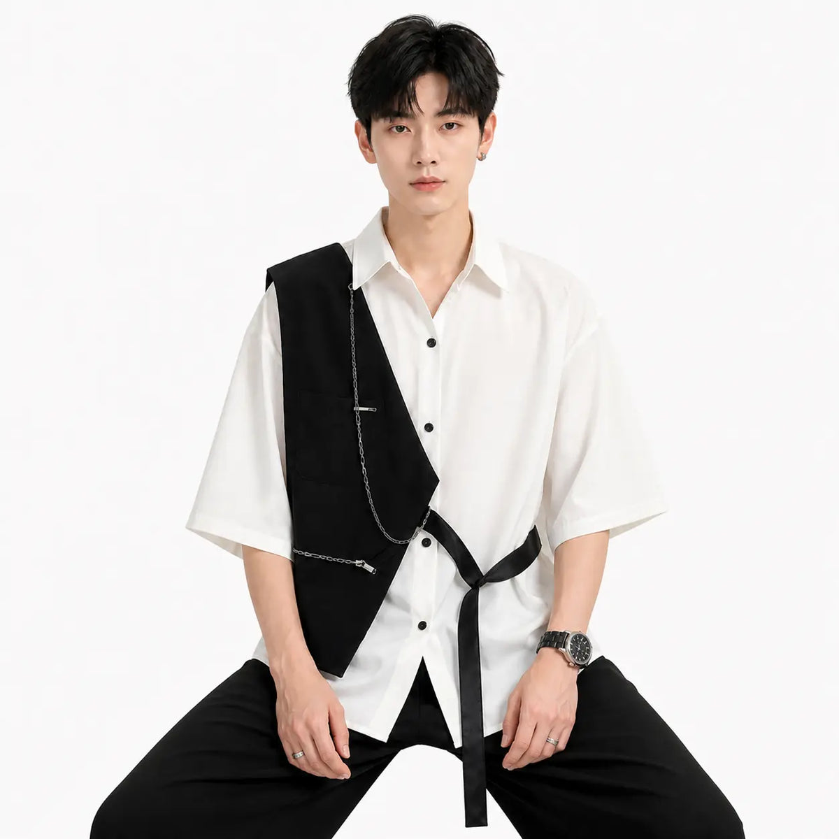 white contrast stitch short sleeve shirt for men on a seated model with black vest and chain detail