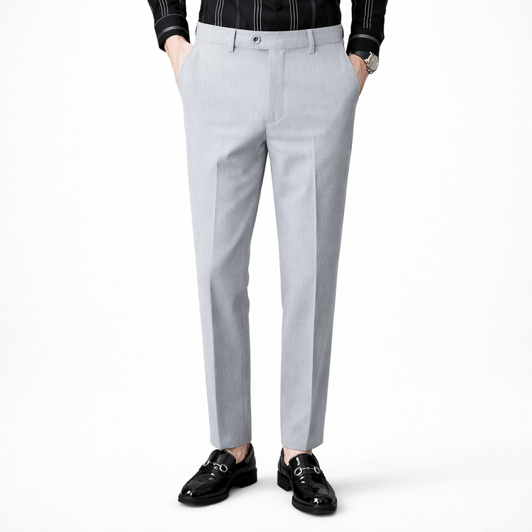 Light gray dress pants worn by a person on a white background