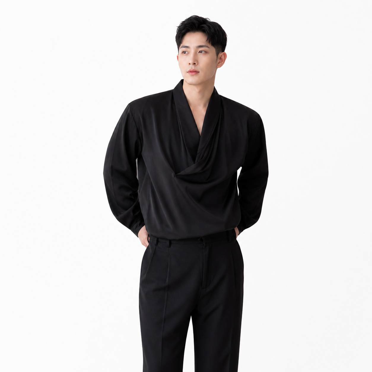 Man wearing a black outfit on a white background