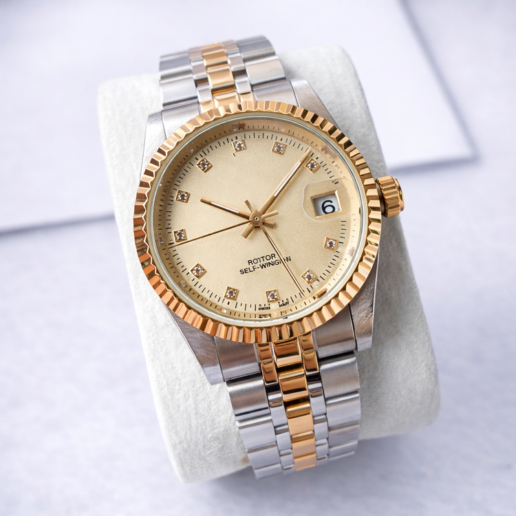 Luxury watch with gold and silver band on a white background
