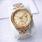 Luxury watch with gold and silver band on a white background