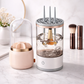 Makeup brush cleaner with brushes inside on a marble surface AND MAKEUP BRUSH STORAGE