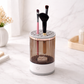 Makeup brush holder with brushes on a white surface